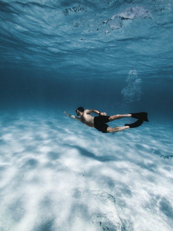 woman in black bikini in water