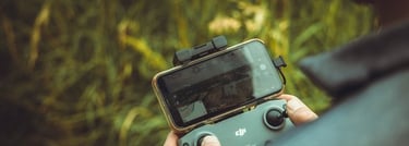person holding black and gray digital camera