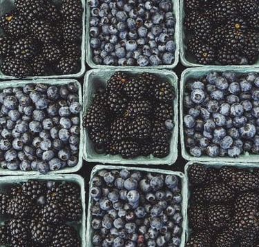 black berries on black surface