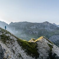 Person hiking in mountains